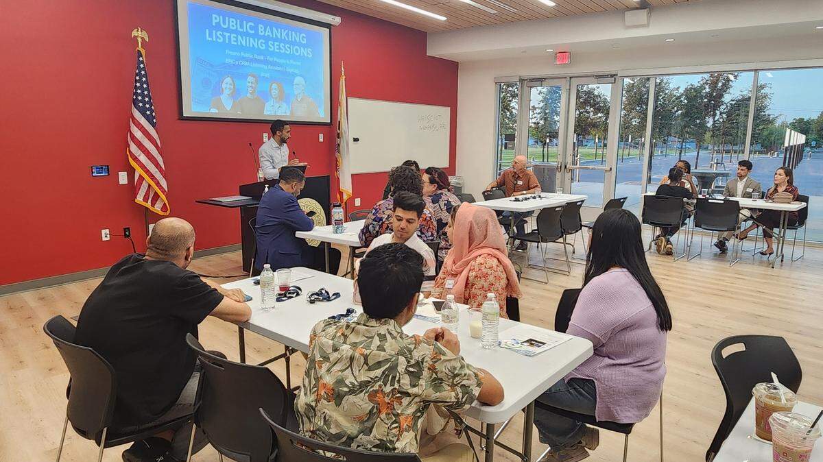 A representative from End Poverty in California explains the concept of a public bank at a Sept. 25 meeting.