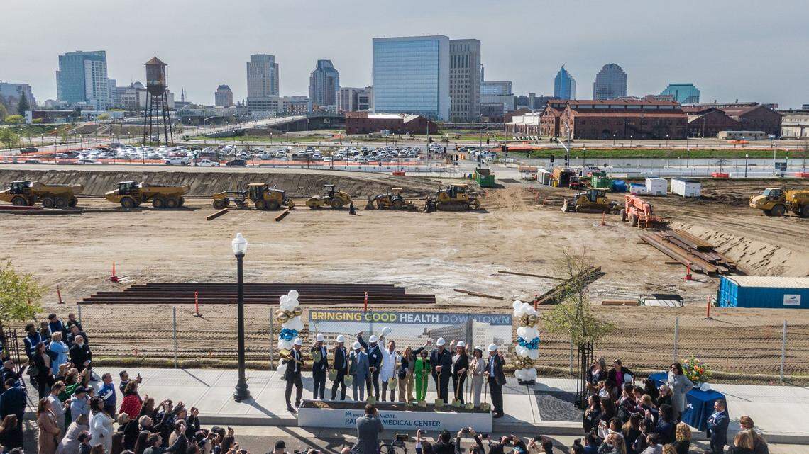 Speakers and dignitaries participate in the groundbreaking for the new Kaiser Permanente Railyards Medical Center on Wednesday, March 19, 2025.  Sacramento officials worry that a county plan to expand into Natomas could compete against city projects closer to the urban core.