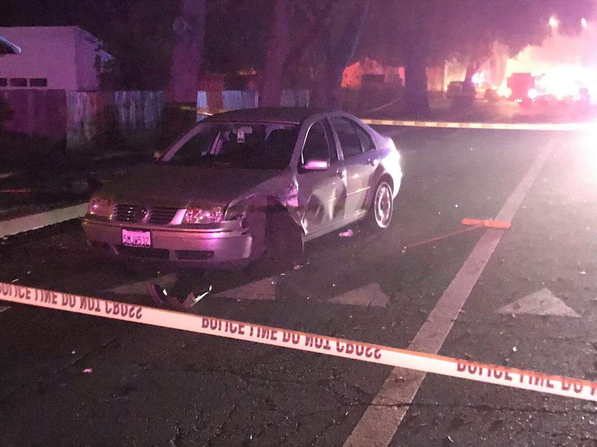 A crashed car sits near the scene where a police officer was shot in Davis on Thursday evening, Jan. 10, 2019.
