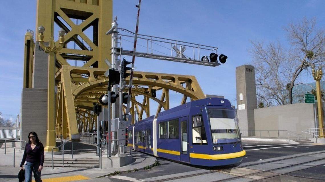 An artist rendering shows a light rail train crossing the Tower Bridge into Sacramento. Regional Transit is moving forward with a plan to construct a line that travels from the Amtrak rail station in Sacramento and crosses Tower Bridge, ending in West Sacramento near Sutter Health Ballpark. (note: the line would run through the middle of the bridge, not on the eastbound lane as shown).