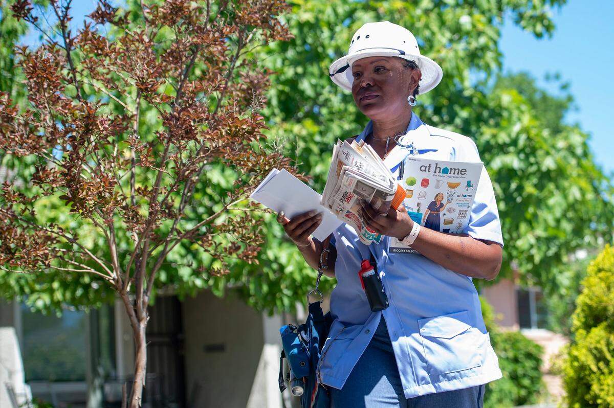 Carol Mondine delivers mail on Sampson Boulevard in Sacramento on Tuesday, June 15, 2021. Sacramento is ranked 16th worst for dog attacks on letter carriers, according to USPS. Mondine was bit by a dog while delivering mail on Jan. 20, 2020.
