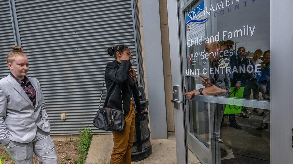 Jasmine Harris, center, and Kristina Tanner, left, with California Youth Connection, are turned away on May 3, 2023, from touring the Warren E. Thornton Youth Center where Sacramento County officials have housed foster youth inside an unlicensed former juvenile detention facility for six months. “We don’t think that youth should be in institutions, we don’t think they should have institutionalized care, they deserved to be seen as individuals,” said Harris. Harris and Tanner are former foster care youth.