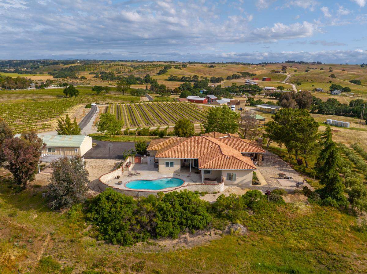 A luxury home, guest house and 57 acres of vineyards for sale in Paso Robles for nearly $5 million.