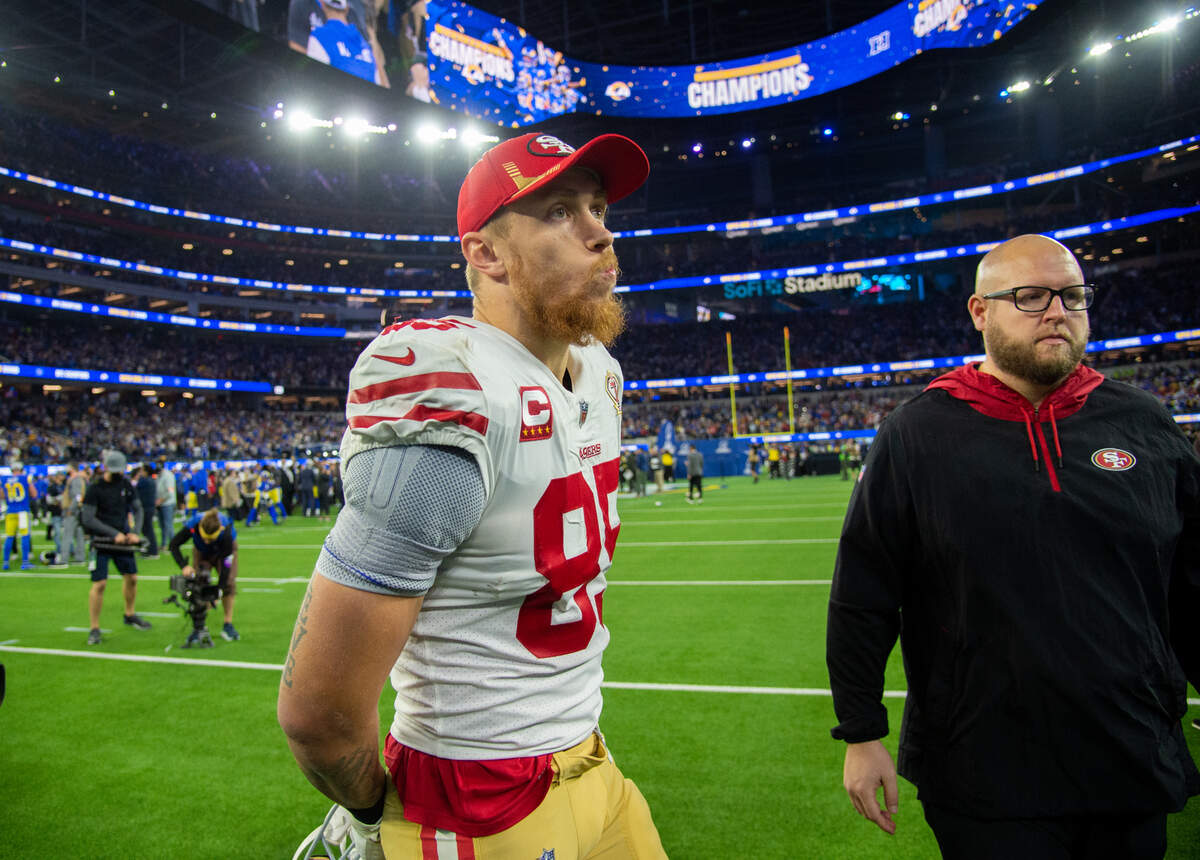 San Francisco 49ers tight end George Kittle walks off the field as the Los Angeles Rams celebrate on the field after 20-17 loss to the Los Angeles Rams during the NFC Championship game at SoFi Stadium on Sunday, Jan. 30, 2022 in Inglewood.