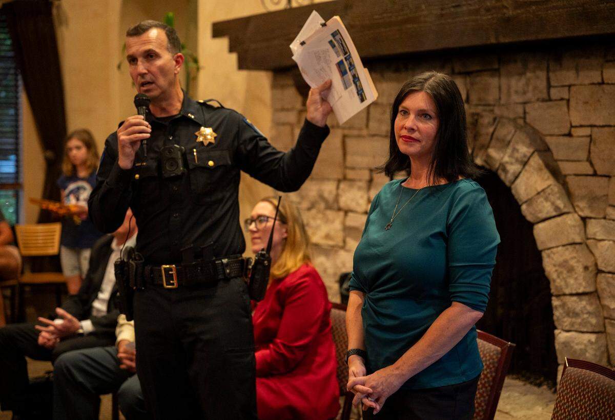 Lt. Doug Morse, acting area captain with the Sacramento Police Department, left, stands with Councilwoman Lisa Kaplan while answering questions during a Community Pedestrian Safety Meeting in North Natomas on Monday at The Club at Natomas Park.