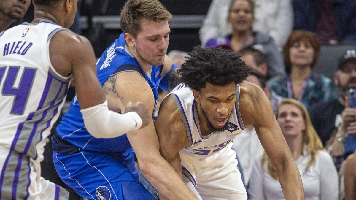 Dallas Mavericks forward Luka Doncic (77) loses the ball to the Sacramento Kings forward Marvin Bagley III (35) on Thursday, March 21, 2019 during their game at the Golden 1 Center in Sacramento, Calif.
