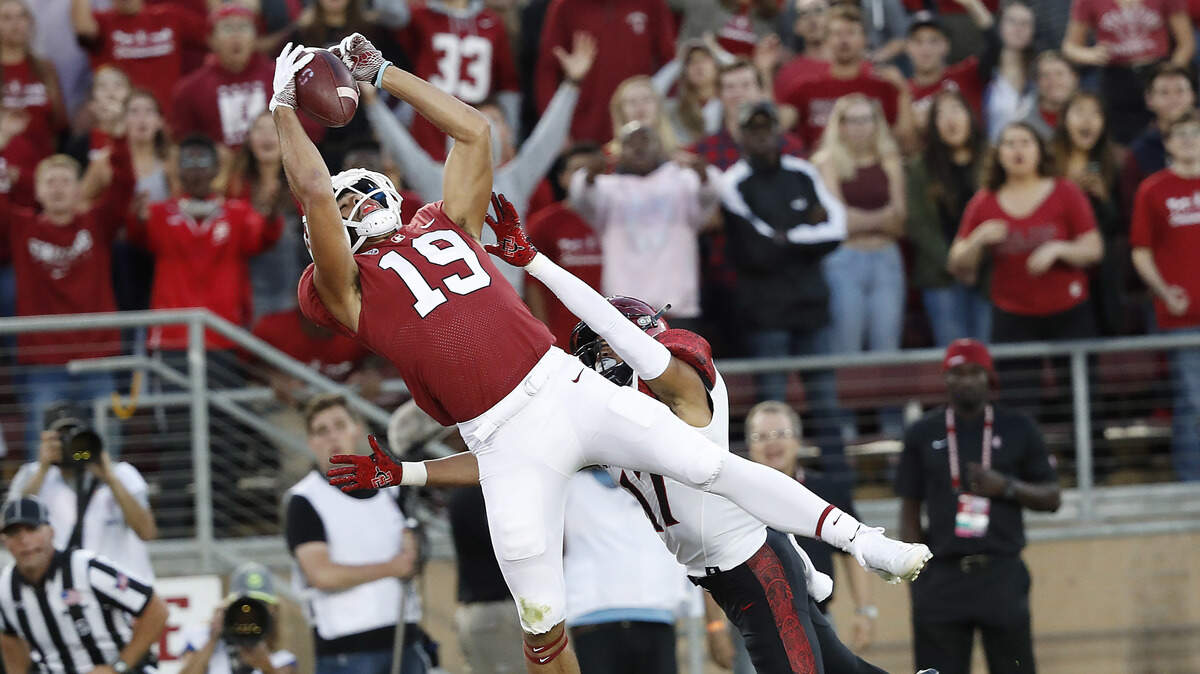 Stanford wide receiver JJ Arcega-Whiteside catches a touchdown pass against San Diego State cornerback Ron Smith on Friday, Aug. 31, 2018. Arcega-Whiteside caught three touchdown passes in the game.
