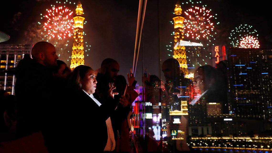 Revelers watch at Drai’s nightclub as fireworks explode on the Las Vegas Strip during a New Year’s celebration Tuesday, Jan. 1, 2019, in Las Vegas. (AP Photo/John Locher)