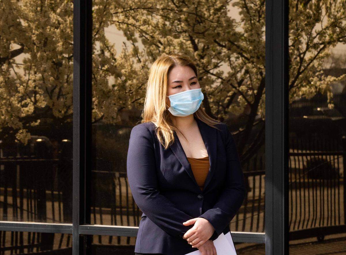 Kelly Shum, owner of Mad Butcher Meat Company, stands outside her store during a press conference on Tuesday, March 2, 2021. In late February, a mutilated cat was found in a box outside of Shum’s butcher shop. The case is being investigated as a hate crime.