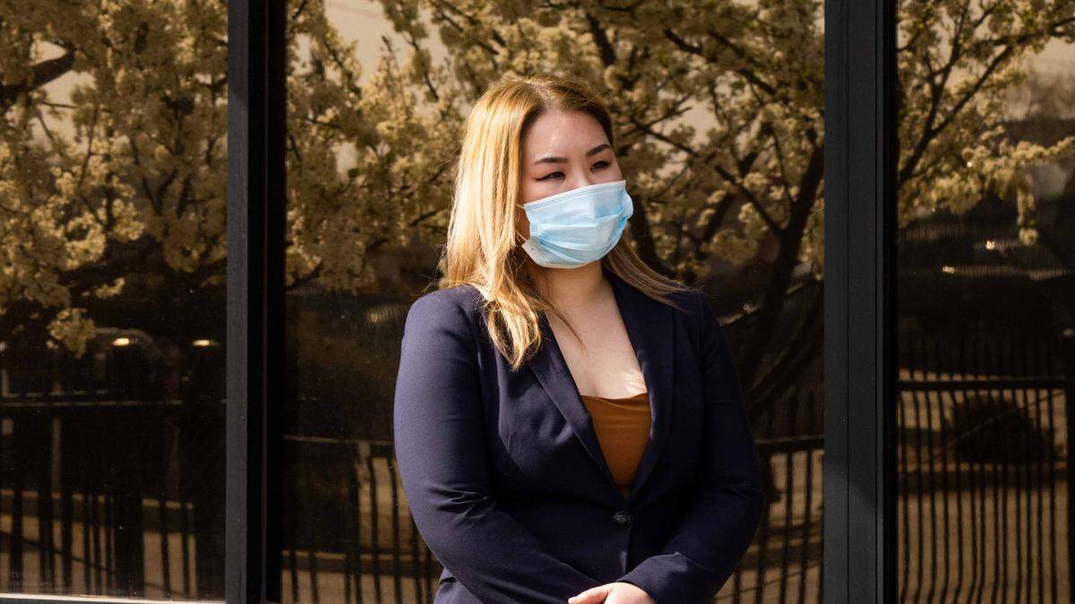 Kelly Shum, owner of Mad Butcher Meat Company, stands outside her store during a press conference on Tuesday, March 2, 2021. In late February, a mutilated cat was found in a box outside of Shum’s butcher shop. The case is being investigated as a hate crime.