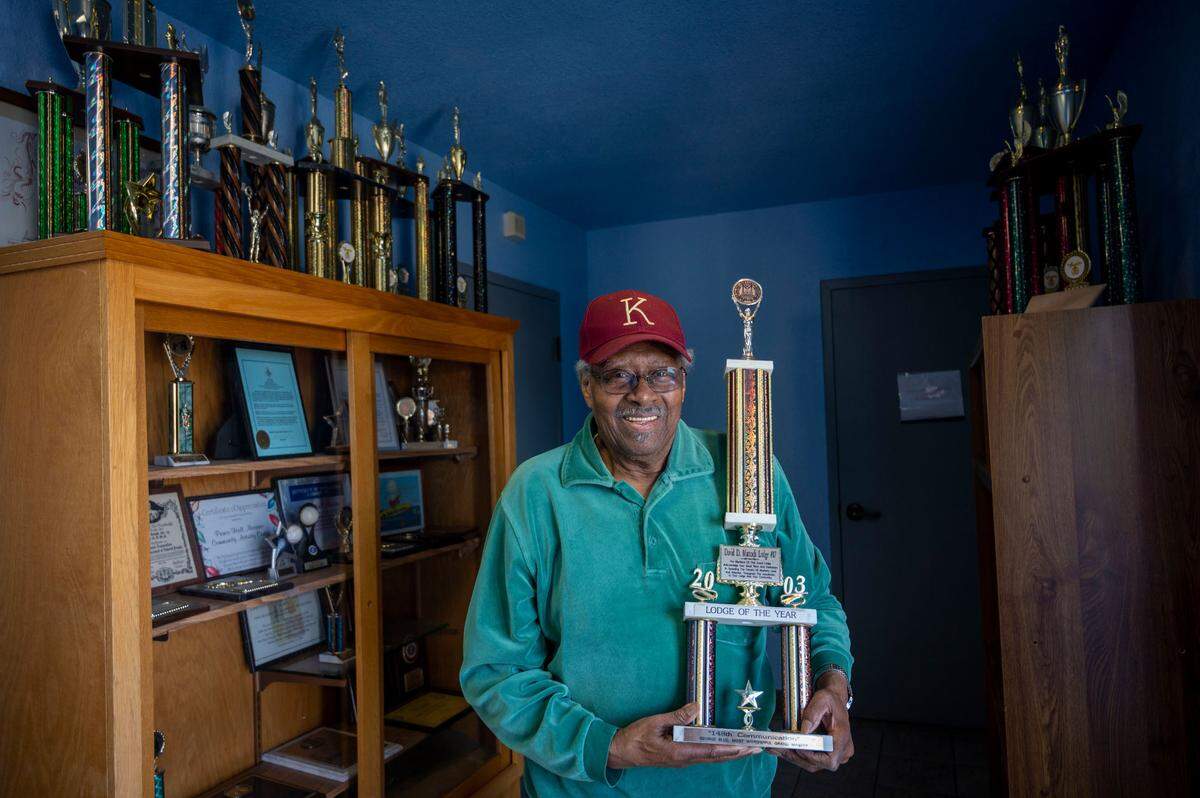 George Blue shows a Lodge of the Year trophy on April 1, awarded to the Prince Hall Freemasons lodge in 2003. Membership have dwindled and they’re currently struggling to keep a partial property tax exemption because the state has ruled that the building isn’t in use enough.