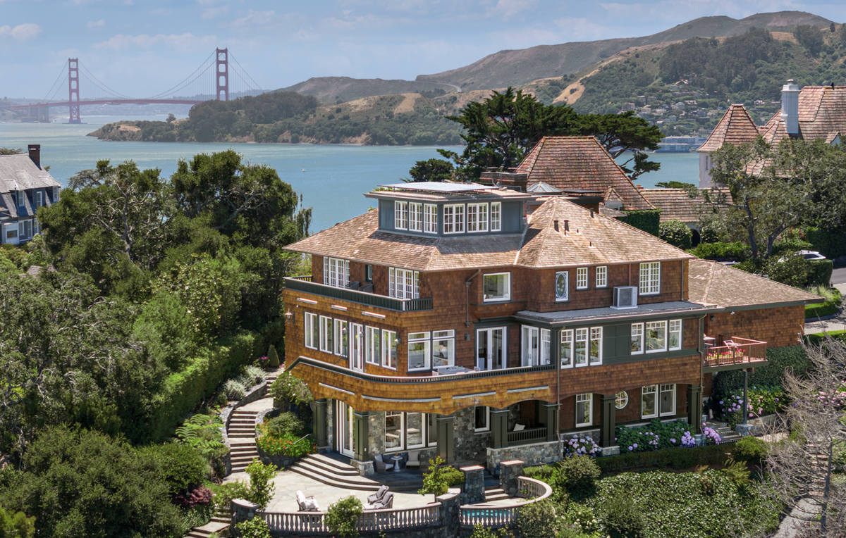 The 1902 home with shingles and unusual overhangs has phenomenal views.