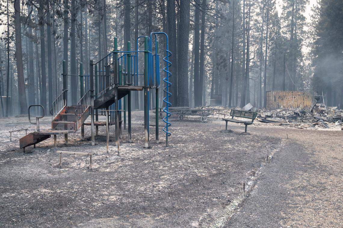 Burned playground equipment stands in front of a flattened structure at Walt Tyler Elementary School after the school was destroyed by Caldor Fire on Tuesday, Aug. 17, 2021, in the in Grizzly Flats community of El Dorado County.