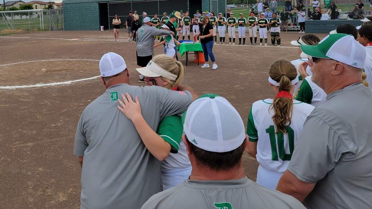 Dixon softball coaches hug players after a 5-1 loss to Monterey in the Northern California Division IV title game Saturday, June 4, 2022.