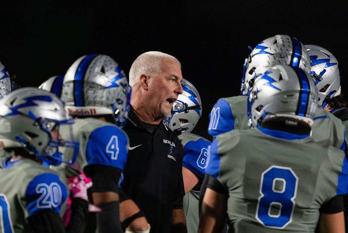 Rocklin coach Jason Adams speaks to his team during a timeout during a 2024 game against the Granite Bay Grizzlies.