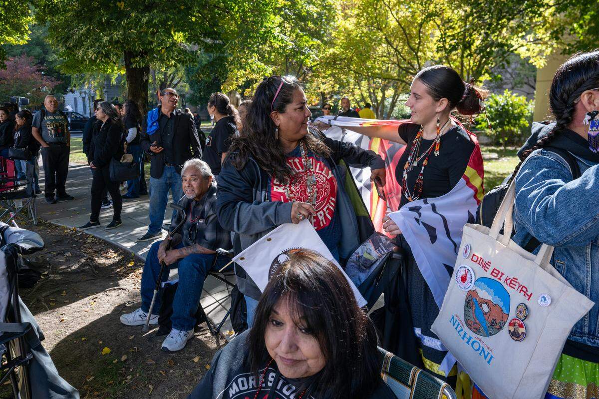 Mickey Nelson, right, who marched with the Esak’timá Center from Sacramento State, embraces Elena Tarango at the Native American Parade on Saturday, Nov. 9, 2024, in downtown Sacramento.