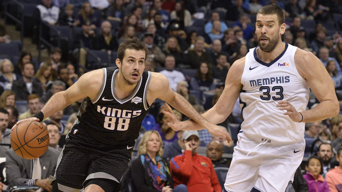 Kings forward Nemanja Bjelica drives past Memphis Grizzlies center Marc Gasol on Friday at FedExForum in Memphis, Tenn.