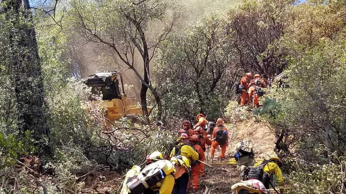 Fire crews worked to contain a small wildfire burning in Placerville on Tuesday, August 3, 2021, known as the Coloma Fire.