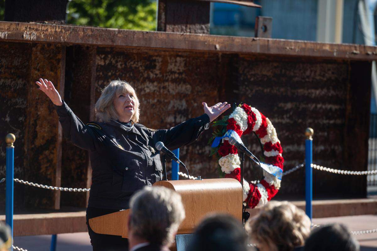 Sacramento law enforcement Chaplain Mindi Russell, who emceed the event and also spoke as a ground zero responder, speaks emphatically about the post-attack unity of the country, and the challenges faced by first responders, at the 9/11 Memorial Ceremony at Cal Expo on Saturday, Sept. 11, 2021, the 20th anniversary of the attacks.