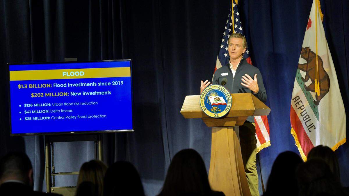Gov. Gavin Newsom discusses spending on flood mitigation while presenting his $297 billion state budget for the 2023-24 fiscal year on Tuesday, Jan. 10, 2023.