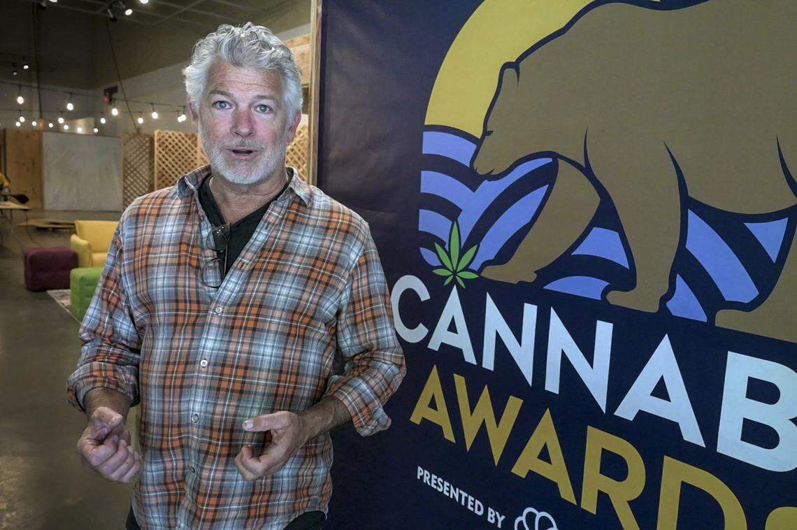 James Leitz, executive producer of the State Fair Cannabis Awards and co-founder of cannabis marketing agency Cultivar Brands, speaks while he puts the finishing touches on the exhibit on July 11, days before the fair’s opening. The awards are a first for the fair, which has long celebrated excellence in livestock, art, wine and other competitions.
