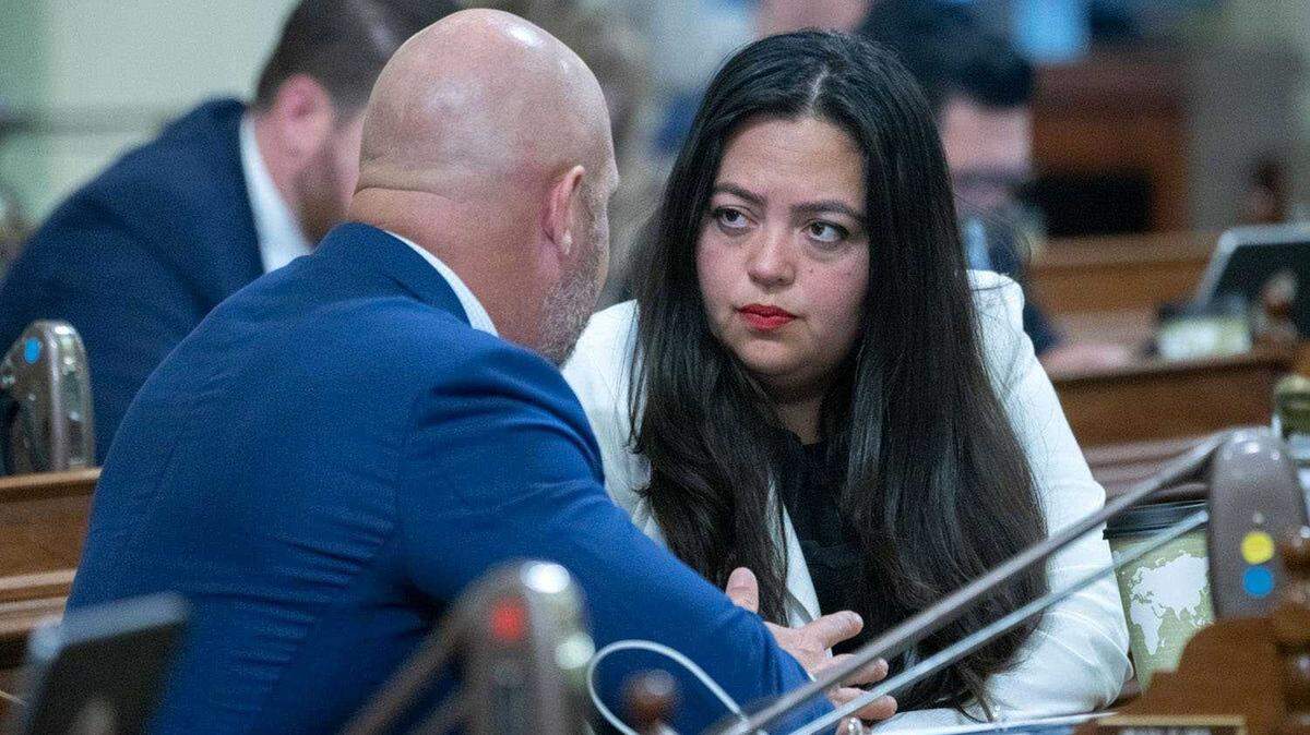 Assemblywoman Wendy Carrillo, D-Los Angeles, talks to a colleague in the Legislature in June. Police said Friday the Los Angeles lawmaker was arrested on suspicion of drunken driving