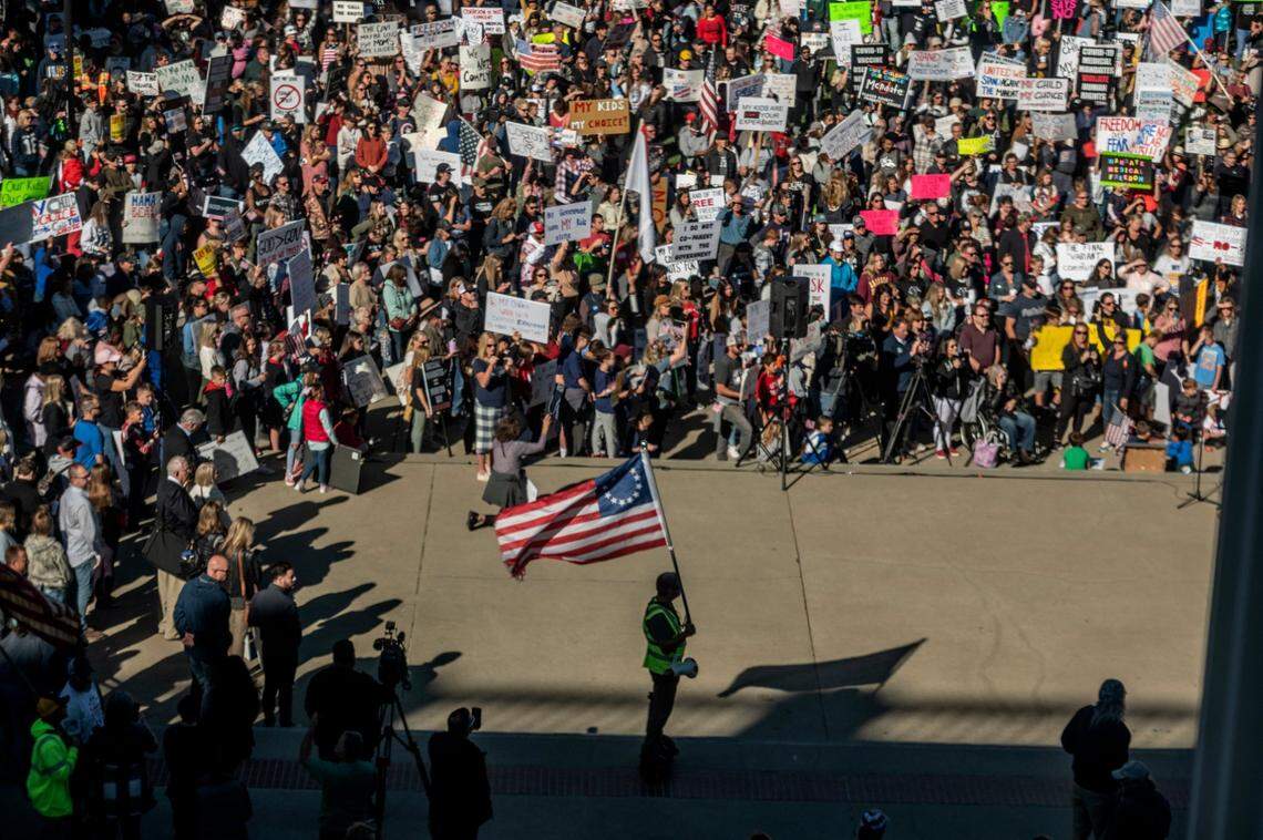 A large crowd attends a Keep Your Kids Home From School rally to protest mandatory COVID-19 vaccinations for schoolchildren at the state Capitol in October.