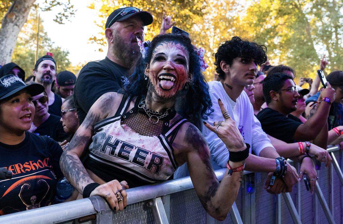 Tanya Freshour of West Sacramento gets ready to cheer, heavy metal style, for Hinder during the Aftershock festival on Sunday, Oct. 5, 2025, in Sacramento’s Discovery Park.