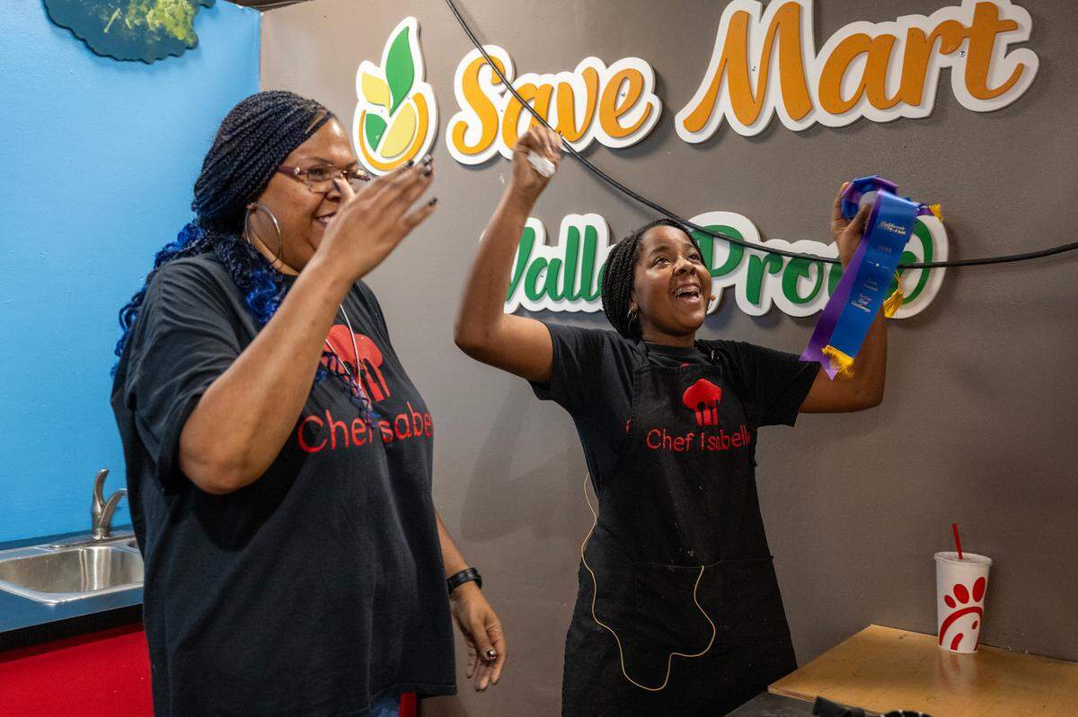 Isabelle Nasah and her mother Andrea Nasah celebrate after their burrito bowl entry was awarded first place in the California Junior Chef Cooking Challenge at the California State Fair on Tuesday, July 22, 2025, in Sacramento.