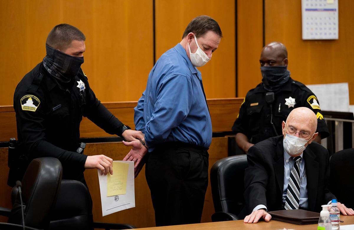 A Sacramento Sheriff’s deputy handcuffs NorCal Rapist Roy Charles Waller after he was found guilty in Sacramento Superior Court on Wednesday, Nov. 18, 2020. Waller was convicted of 46 counts related to raping nine women in six Northern California cities between 1991 and 2006 based on DNA evidence.