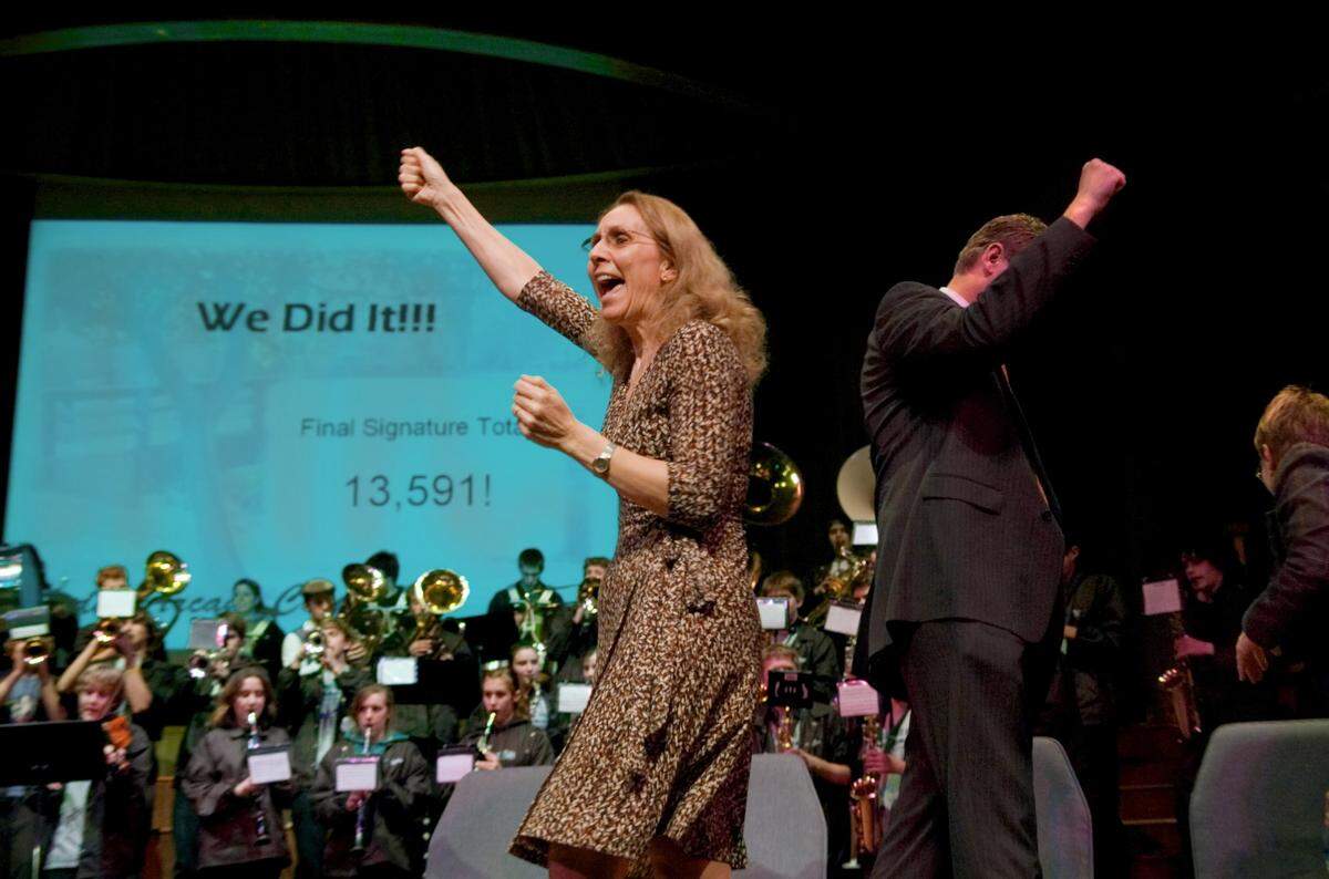 Co-chairs of the Arden Arcade Incorporation Committee Laura Lavallee, left, and Joel Archer cheer in 2007 as the number of petition signatures the committee has collected is revealed at Arcade Church. They needed 9,500 signatures to get the issue to the ballot, and they had 13,591.