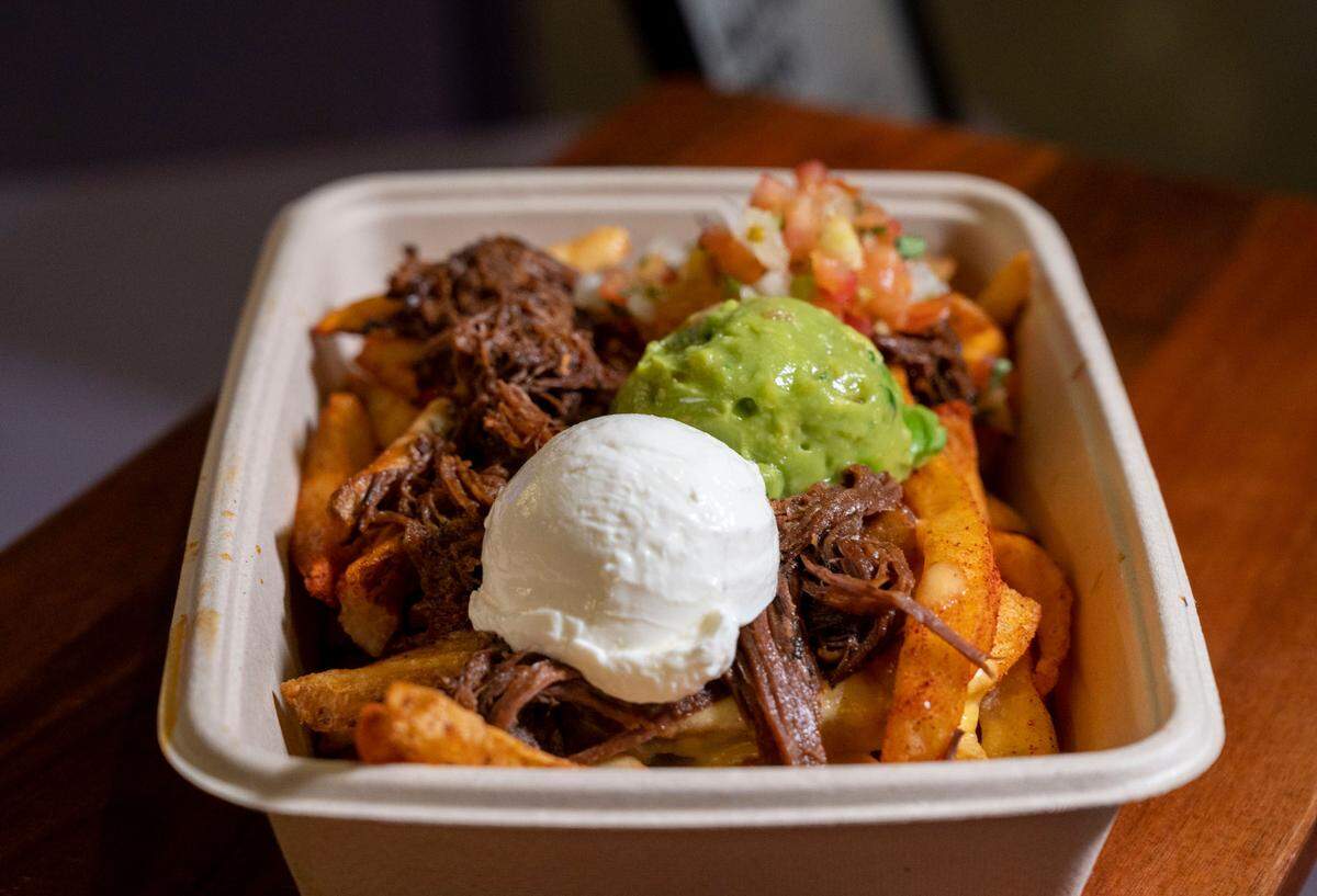 Centro’s Sactown Fries are topped with 16-hour slow-cooked Richards grass-fed beef, nacho cheese sauce, guacamole, pico de gallo and sour cream on chili lime fries.