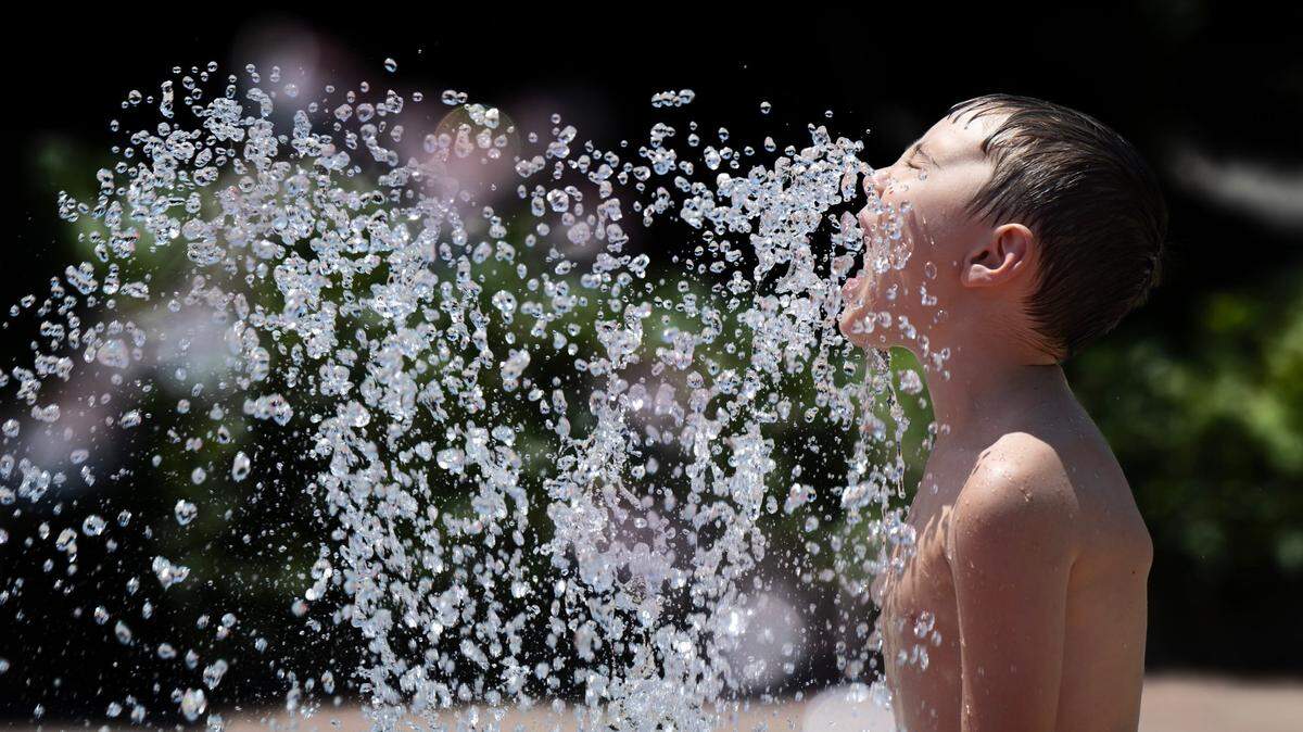 Gavin Toscno, 6, of Rancho Cordova, cools down in a water fountain at Village Green Park on Thursday, July 11, 2024, in Rancho Cordova.