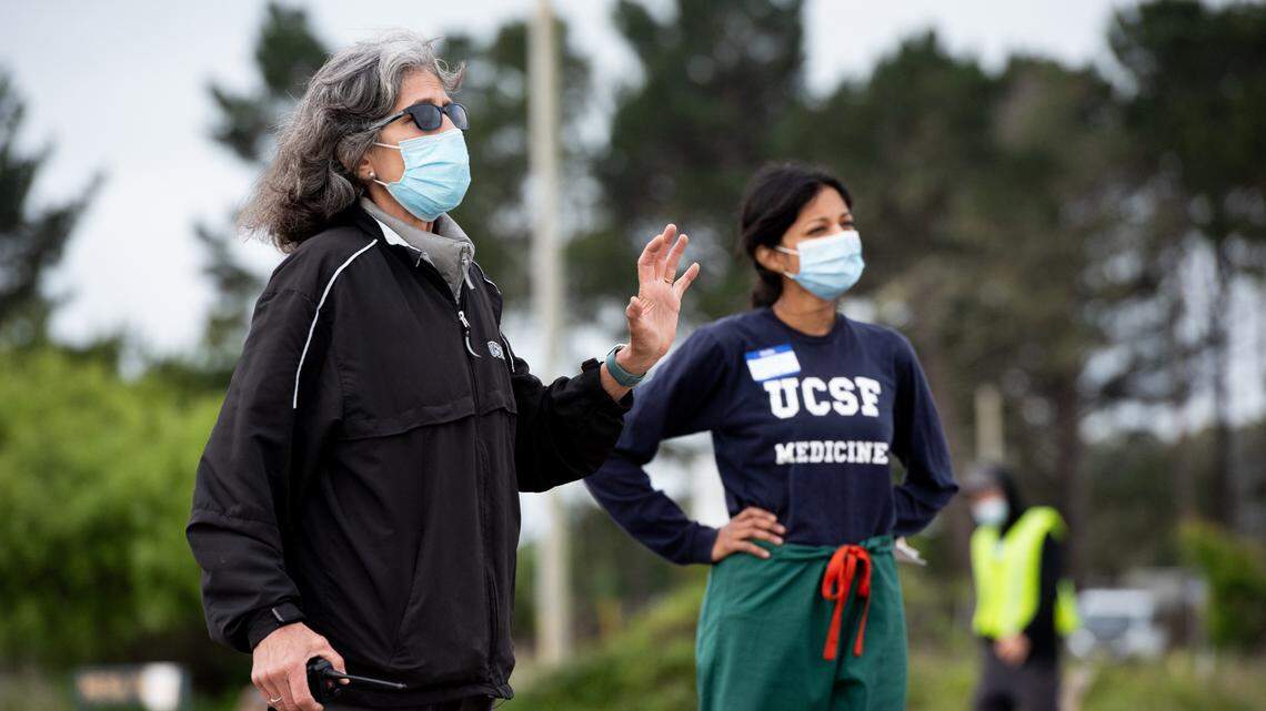 Dr. Aenor Sawyer, left. gives morning instruction gives along with UCSF Clinical Fellow Ayesha Appa to a team of volunteers and medical staff before they begin taking samples. A UCSF orthopedist who lives in Bolinas, Sawyer oversaw the testing program in the Marin County town.