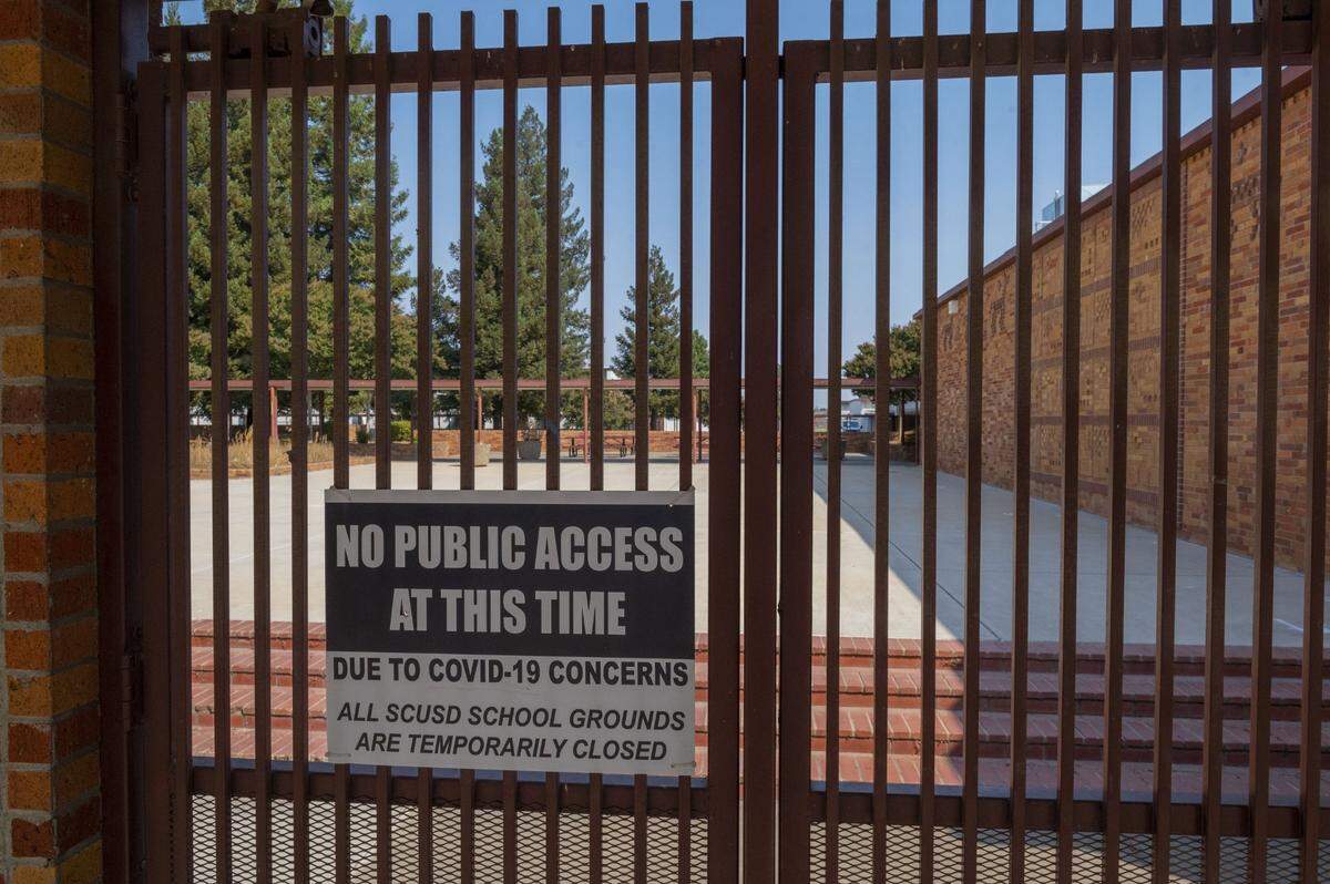 On the first day of school in September 2020, the gate is closed to Hiram W. Jackson High School due to distance learning amid the coronavirus pandemic.