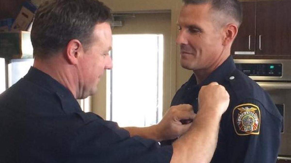Sean Dail receives a promotion to fire captain during a Sacramento Fire Department ceremony in 2016. The city fired Dail in March 2023 for working on his real estate business and going to the gym when he was on the clock.
