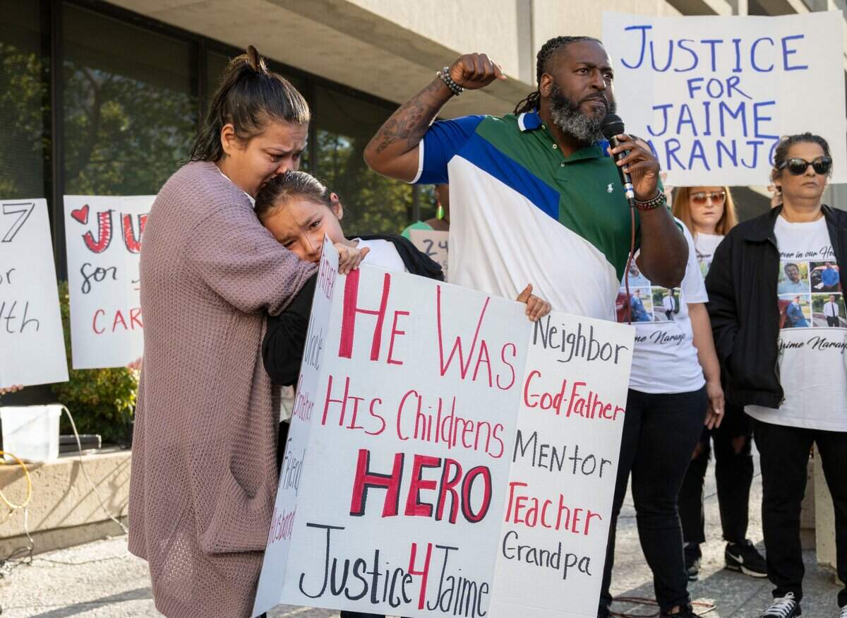 Ericka Naranjo, left, hugs her daughter Joselynn Murillo Naranjo, 10, on Tuesday, Oct. 4, 2022 as Berry Accius, of Voices of the Youth, demands justice for Jaime Naranjo, who was killed by a Sacramento Sheriff’s deputy last week.