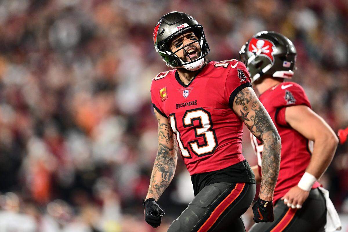 Mike Evans of the Tampa Bay Buccaneers celebrates after scoring a touchdown against the Washington Commanders during the second quarter in the NFC Wild Card Playoff at Raymond James Stadium on Jan. 12, 2025 in Tampa, Florida.