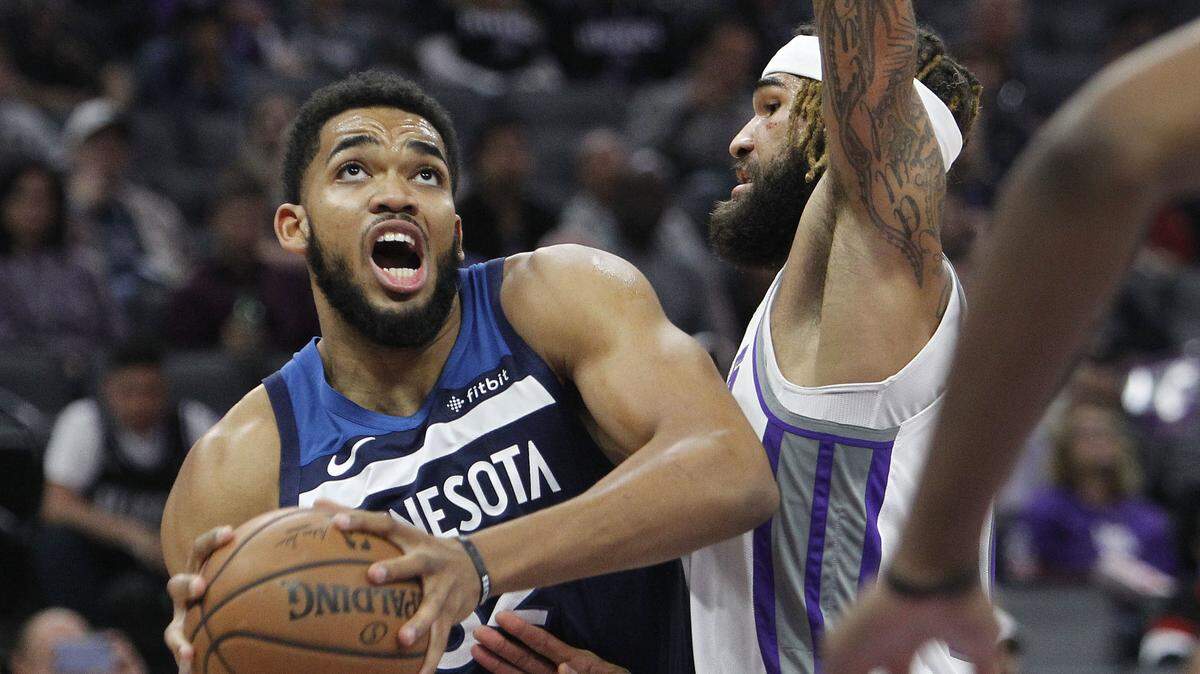 Minnesota Timberwolves center Karl-Anthony Towns, left, and Kings center Willie Cauley-Stein each led their team in scoring Friday at Golden 1 Center.