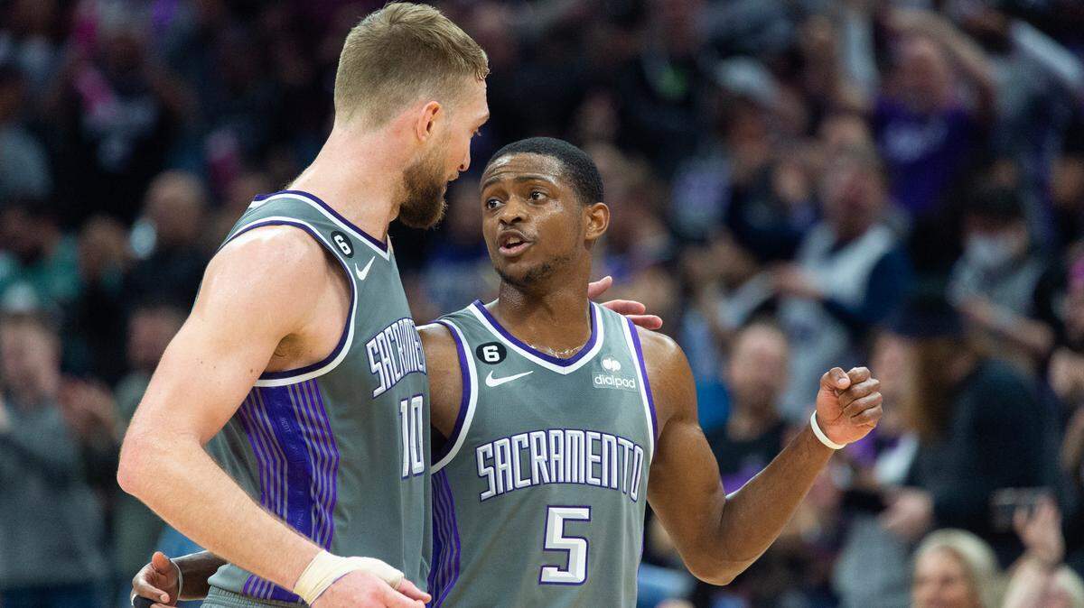 Sacramento Kings guard De’Aaron Fox (5) and Sacramento Kings forward Domantas Sabonis (10) walk to the bench during a time out as they lead the New York Knicks in the fourth quarter during a game at Golden 1 Center in Sacramento, Thursday, March 9, 2023.