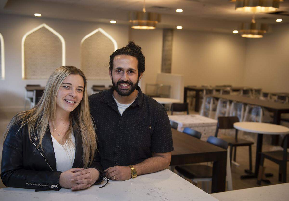 Owners of Maydoon Idean Farid and Jen Farid stand inside their new Persian restaurant opening soon on 16th Street in midtown Sacramento on Tuesday, Jan. 28, 2020.