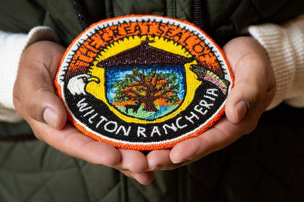 Wilton Rancheria tribal chairman Jesus Tarango holds the tribal medallion he wears around his neck earlier this month.