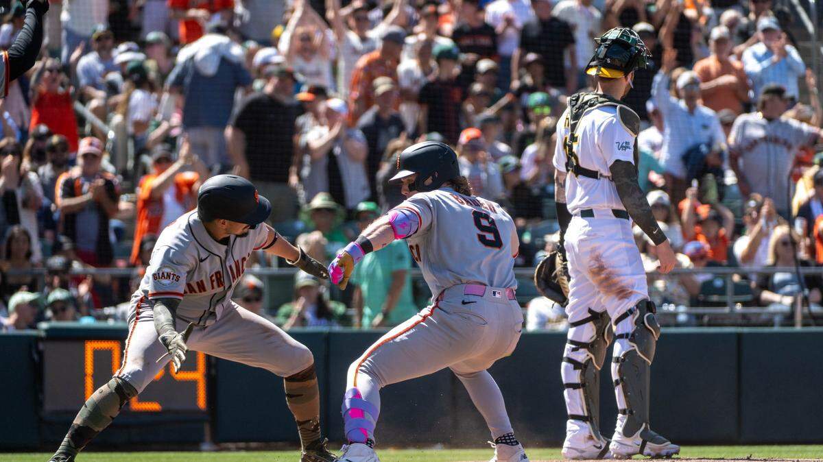 San Francisco Giants center fielder Harrison Bader (9) celebrates with San Francisco Giants shortstop Willy Adames (2) after his grand slam in the eighth inning during a game at Sutter Health Park on Sunday, May 17, 2026 in West Sacramento.