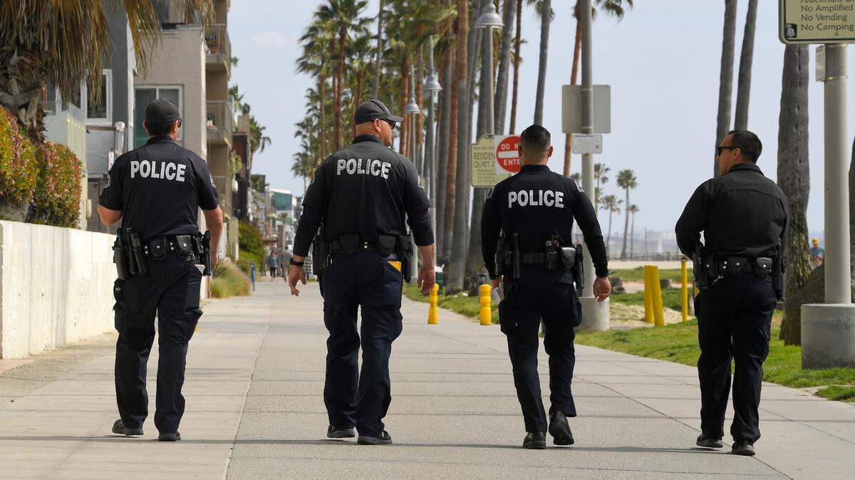 Los Angeles police officers patrol Venice Beach on March 28. The largest police unions in California unveiled plans Sunday for a reform agenda. It involves police in L.A., San Francisco and San Jose.