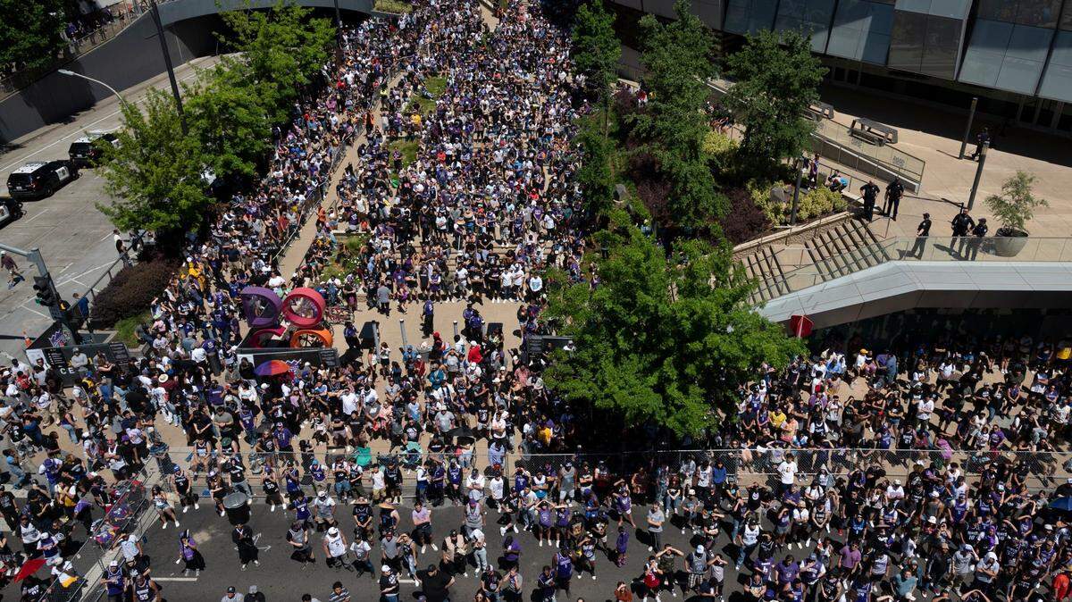 Fans watch the game on three big screens on the garage on L Street in the outdoor Section 916 watch party area as a crowd fills the Downtown Commons plaza in Sacramento during the first half of Game 7 of the NBA playoff series between the Sacramento Kings and the Golden State Warriors on Sunday, April 30, 2023.