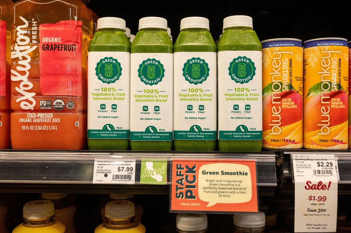 Bottles of vegetable and fruit smoothie blend from Green Smoothie Co. are displayed at the Sacramento Natural Foods Co-op earlier this month. Labels next to the price indicate the product is local to California and a staff pick.