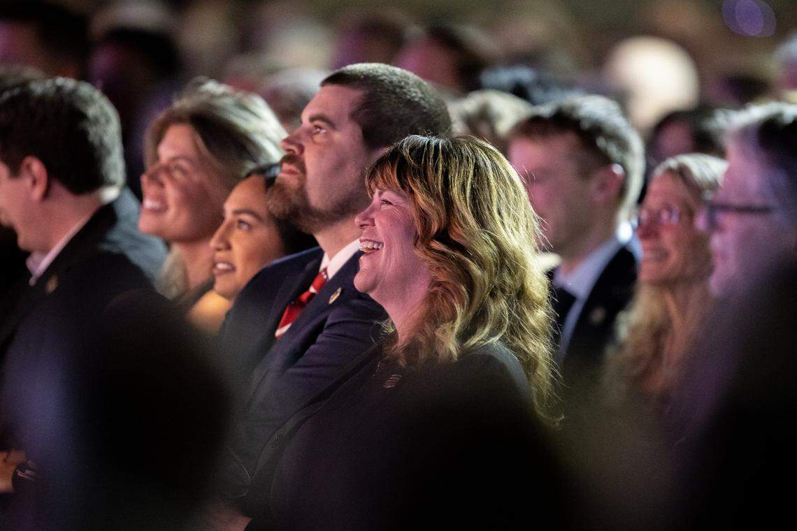 Jill LaMalfa laughs while recalling a story shared by Speaker of the House Mike Johnson during the memorial service for Rep. Doug LaMalfa at the Silver Dollar Fairgrounds in Chico on Saturday.