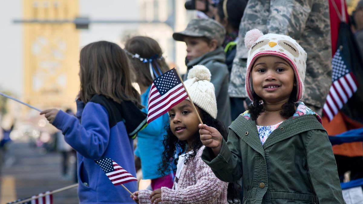 Children watch a Veterans Day Parade in downtown Sacramento in 2015.