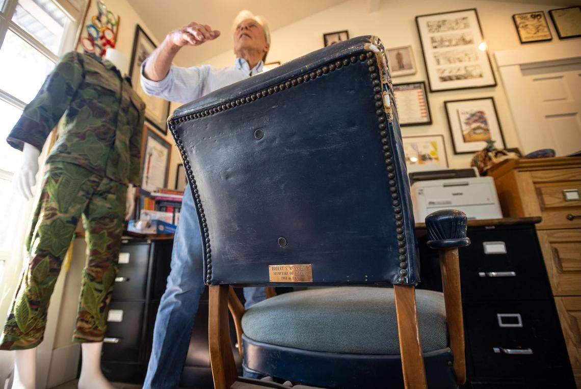 “The story is that as Mrs. Kennedy was back in the White House, she wanted to give my father a memento that she thought President Kennedy would want him to have,” Craig McNamara said, referring to the worn chair he stands with that was once used by his father, former Defense Secretary Robert McNamara. Craig McNamara spoke about his father, known as the architect of the Vietnam War, at his organic walnut farm near Winters on Aug. 18.