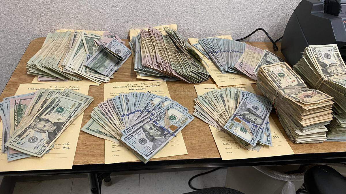 Roughly $70,000 in cash along with guns, ammo and marijuana were confiscated after Sacramento County probabion officers served a search warrant Thursday, March 2, 2023.